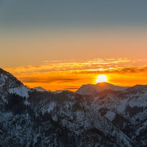 Scenic view of mountains against sky during sunset