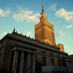 Palace of culture and science against sky in city