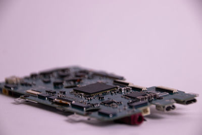 Close-up of toy on table against pink background