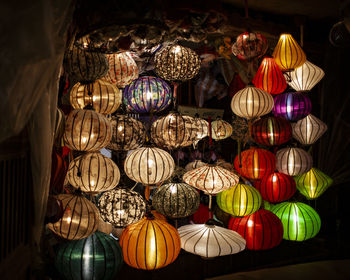 Low angle view of illuminated lanterns hanging on ceiling