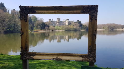 Reflection of trees in lake against sky