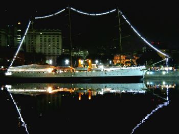 Boats moored at harbor