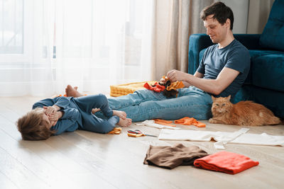Full length of man playing with toy at home