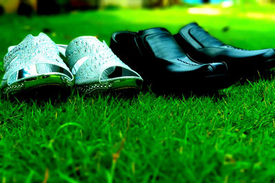 Close-up of shoes on field