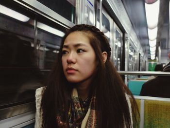 Portrait of beautiful woman on public transport