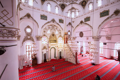 Low angle view of illuminated chandelier in building