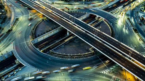 High angle view of light trails on road at night