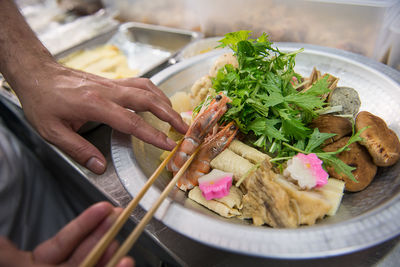 Close-up of hand holding food