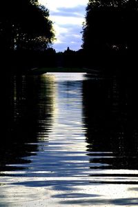 Reflection of trees in lake against sky