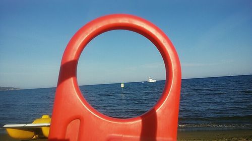 Close-up of sea against clear blue sky