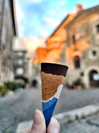 Hand holding ice cream cone