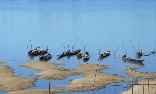 High angle view of fishing boats moored in sea