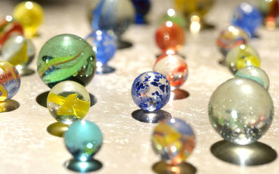 Close-up of multi colored balls on table