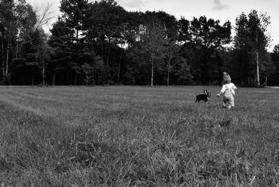 People on field against trees