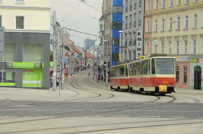 View of railroad tracks by buildings in city