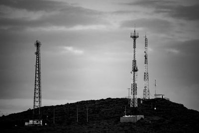 Low angle view of communications tower against sky