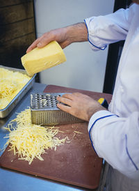 Midsection of man preparing food