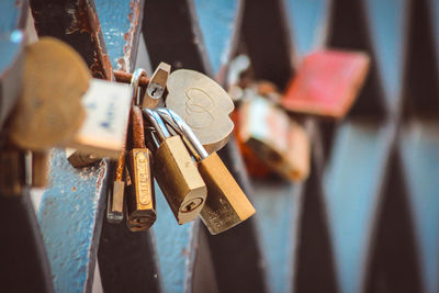 Close-up of padlocks hanging on metal