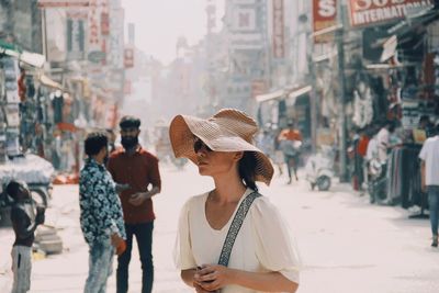 People standing on street in city