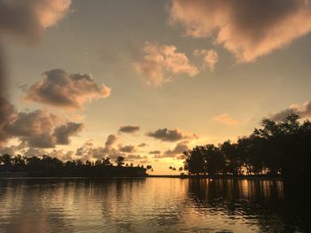 Scenic view of lake against sky during sunset