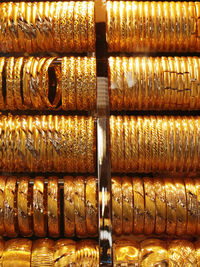 Gold bangles for sale at market stall