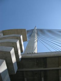 Low angle view of modern building against clear blue sky