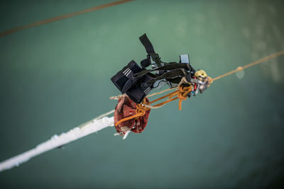 Close-up of bungee equipment hanging on rope