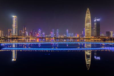 Illuminated buildings in city at night