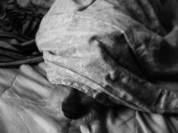 High angle view of young woman lying on tiled floor