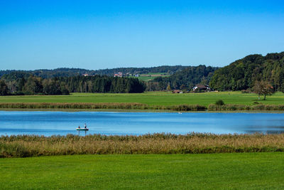 Scenic view of lake against clear sky