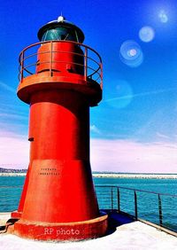 Lighthouse against blue sky