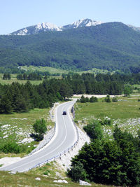 High angle view of road amidst mountains