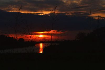 Scenic view of sunset over river