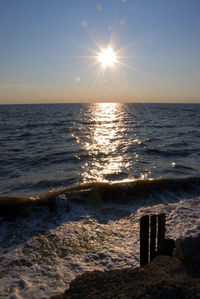 Scenic view of sea against clear sky during sunset