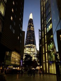 Low angle view of modern buildings at night