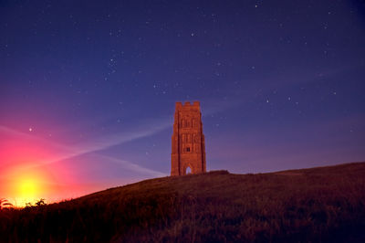 Castle against sky at night