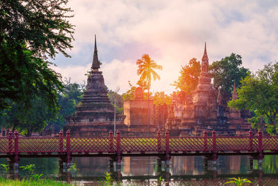 View of temple building against cloudy sky