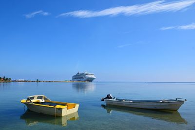 Ship moored in sea against sky