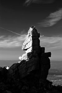 Low angle view of rock against sky