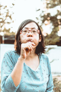 Portrait of young woman looking away