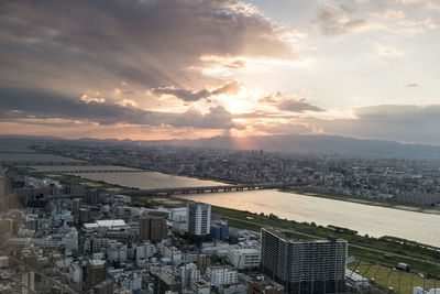 High angle view of river along cityscape