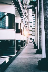 Empty walkway by building