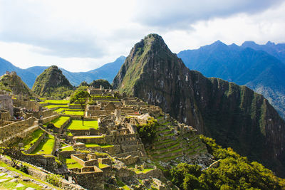 Scenic view of mountains against cloudy sky