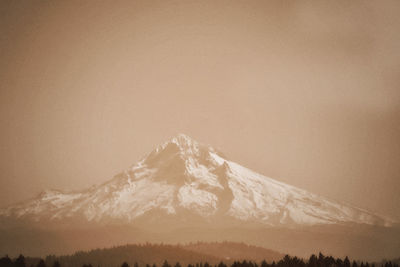 Scenic view of snowcapped mountains against clear sky