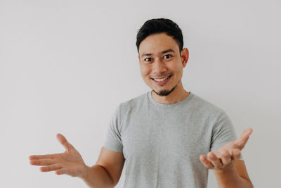 Portrait of young man against white background