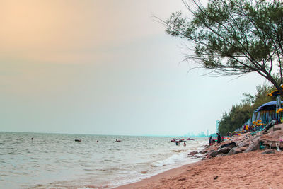 Scenic view of beach against sky during sunset