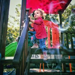 Low angle view of girl playing in park