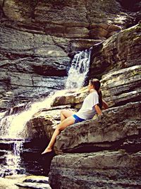 Woman standing on rock formation