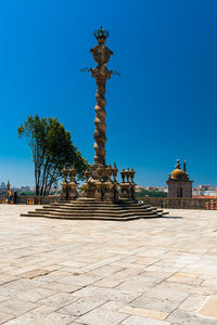 Sculpture of building against blue sky