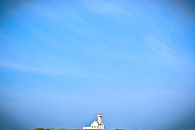 Low angle view of built structure against blue sky